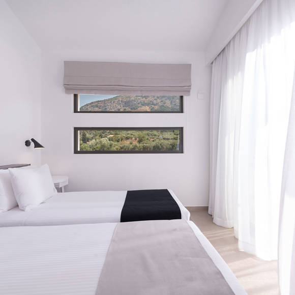 Elegant two bedroom villa with twin beds and mountain view windows at Avdou Collection Crete